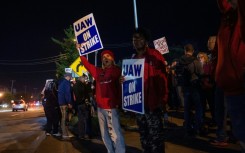 UAW members picket outside of the Local 900 headquarters across the street from a Ford assembly plant in Wayne, Michigan on September 15, 2023