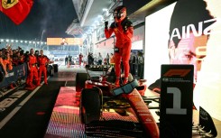 Ferrari's Spanish driver Carlos Sainz Jr celebrates winning the Singapore Formula One Grand Prix night race at the Marina Bay Street Circuit in Singapore on September 17, 2023.