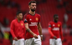 A dejected Bruno Fernandes leaves the pitch at Old Trafford after the 3-1 defeat by Brighton