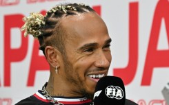 Mercedes' British driver Lewis Hamilton speaks to the media before the Formula One Japanese Grand Prix at Suzuka