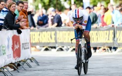 Teenage dream: Britain's Joshua Tarling rides to victory in the individual time trial 