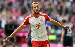 Record-breaker: Bayern Munich's Harry Kane celebrates scoring a hat-trick in the 7-0 win over Bochum on Saturday