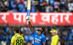 Top man: India's Shreyas Iyer celebrates after scoring a century on Sunday