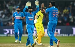 India's Ravichandran Ashwin (R) made a triumphant return to ODI cricket against Australia