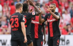 Victory: Leverkusen players celebrate their win over Mainz 