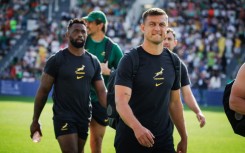 South Africa fly-half Handre Pollard (R) and South Africa captain Siya Kolisi (L)