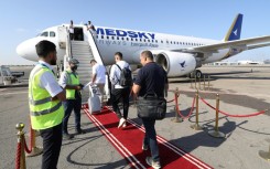 Passengers board the first Libyan-operated flight from Tripoli to Rome in nearly a decade at Mitiga airport