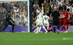 Liverpool defender Joel Matip (No. 32) reacts after conceding the own goal that gave Tottenham Hotspur victory 