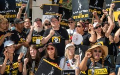 Some of the SAG-AFTRA negotiating committee address members at the picket line outside Warner Brothers offices in Burbank, California