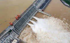Water is released from the Three Gorges Dam, a hydropower project on the Yangtze river, in central China's Hubei province, in 2020
