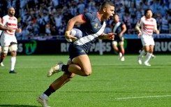 Argentina centre Santiago Chocobares runs to score the opening try against Japan