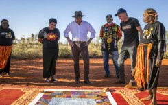 Australian Prime Minister Anthony Albanese (C) talks with Indigenous leaders from central Australia