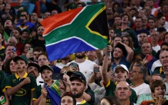 Spectators wave a South Africa flag at a Rugby World Cup game in Marseille