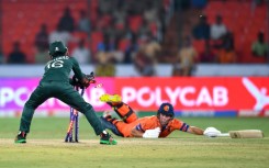 That's out: Pakistan's Mohammad Rizwan runs out Netherlands' Roelof van der Merwe in the opening game