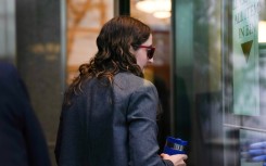 Sam Bankman-Fried's former girlfriend, Caroline Ellison, walks through security at Manhattan Federal Court on October 10, 2023, in New York
