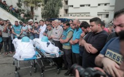 Mourners attend the funeral of fellow journalists Said al-Taweel and Mohammed Sobboh, who were killed in an Israeli airstrike on Gaza City 