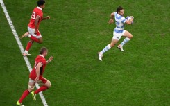 Argentina fly-half Nicolas Sanchez (right) streaks clear to score the match-clinching try in the World Cup quarter-final against Wales