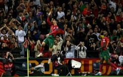 Cristiano Ronaldo scored twice as Portugal beat Slovakia to qualify for next year's Euros
