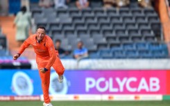 Familiar face: Netherlands' Roelof van der Merwe bowls during the World Cup match with New Zealand in Hyderabad 