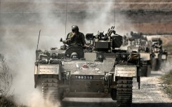 Thousands of Israeli troops and heavy weaponry are amassed on the border with Gaza