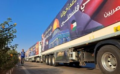 Aid lorries wait in neighbouring Egypt for an agreement to allow desperately needed supplies into the war-battered Gaza Strip