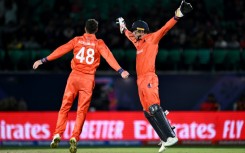Let's celebrate: Netherlands captain Scott Edwards with Colin Ackermann after taking the catch to dismiss South Africa's Quinton de Kock 