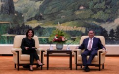 China's Premier Li Qiang (R) speaks with US Commerce Secretary Gina Raimondo in Beijing in August 2023