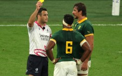 South Africa lock Eben Etzebeth (R) is shown a yellow card by Ben O’Keeffe (L) during the thrilling win over France