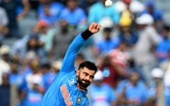 Bowling not batting: India's Virat Kohli bowls in a ODI for the first time in six years on Thursday during the World Cup match against Bangladesh