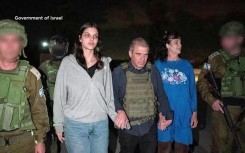 This handout picture courtesy shows Natalie Shoshana Raanan (2nd L) and Judith Tai Raanan (2nd R) after being released by Hamas at an undisclosed location