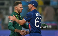 'Tough position': England captain Jos Buttler (right) with Africa's David Miller after Saturday's match