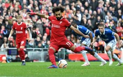 Mohamed Salah scores the opening goal from the penalty spot as Liverpool beat Everton 