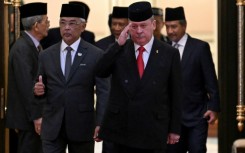 Malaysia's King Sultan Abdullah Sultan Ahmad Shah (2nd L) and Sultan Ibrahim Sultan Iskandar of Johor (2nd R) walk together after the election for the next Malaysian king