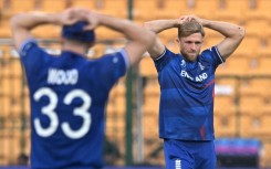 That losing feeling: England's David Willey (right) and Mark Wood react after a dropped catch off Sri Lanka captain Kusal Mendis on Thursday