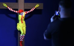 A visitor looks at 'McJesus' by Finnish artist Jani Leinonen at a new Barcelona museum dedicated to art that has been censored