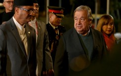 United Nations Secretary General Antonio Guterres (R) walks with Nepal's Foreign Minister Narayan Prakash Saud 