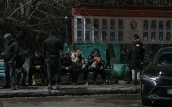 Relatives of miners gather outside the Kostyenko ArcelorMittal coal mine building 