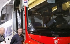 The smashed window of Lyon's team bus is visible after stones were thrown as it travelled to Marseille's Velodrome stadium

