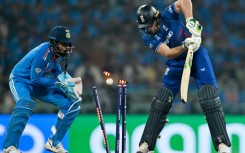 Down and almost out: England captain Jos Buttler is clean bowled by India's Kuldeep Yadav on Sunday