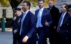 Donald Trump, Jr (2nd L) and Eric Trump (C) have both testified in their father's fraud trial