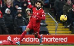 Liverpool star Mohamed Salah runs with the ball against Brentford at Anfield
