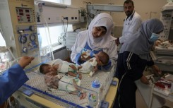 Palestinian medics care for premature babies evacuated from Al-Shifa hospital to the Emirates hospital in Rafah, the southern Gaza Strip