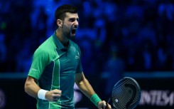 Djokovic celebrates winning a record-breaking seventh ATP Finals title