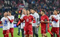 Serbia's players celebrate reaching the European Championship for the first time