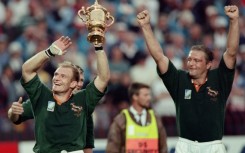Hannes Strydom (R) alongside captain Francois Pienaar after South Africa won the 1995 Rugby World Cup final in Johannesburg. 
