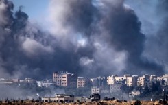 Somke rises over multiple targets in the Gaza Strip after an Israeli bombardment on Tuesday