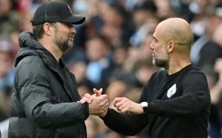 Jurgen Klopp (left) is preparing his Liverpool side to face Pep Guardiola's Manchester City