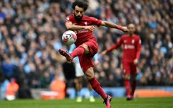 Liverpool star Mohamed Salah shoots against Manchester City
