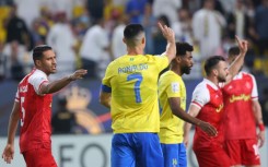 Cristiano Ronaldo wags his finger and says there was no foul after the referee awarded a penalty in the AFC Champions League