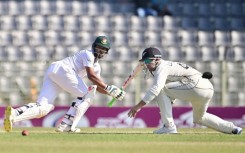 Bangladesh’s Najmul Hossain Shanto (L) plays a shot 